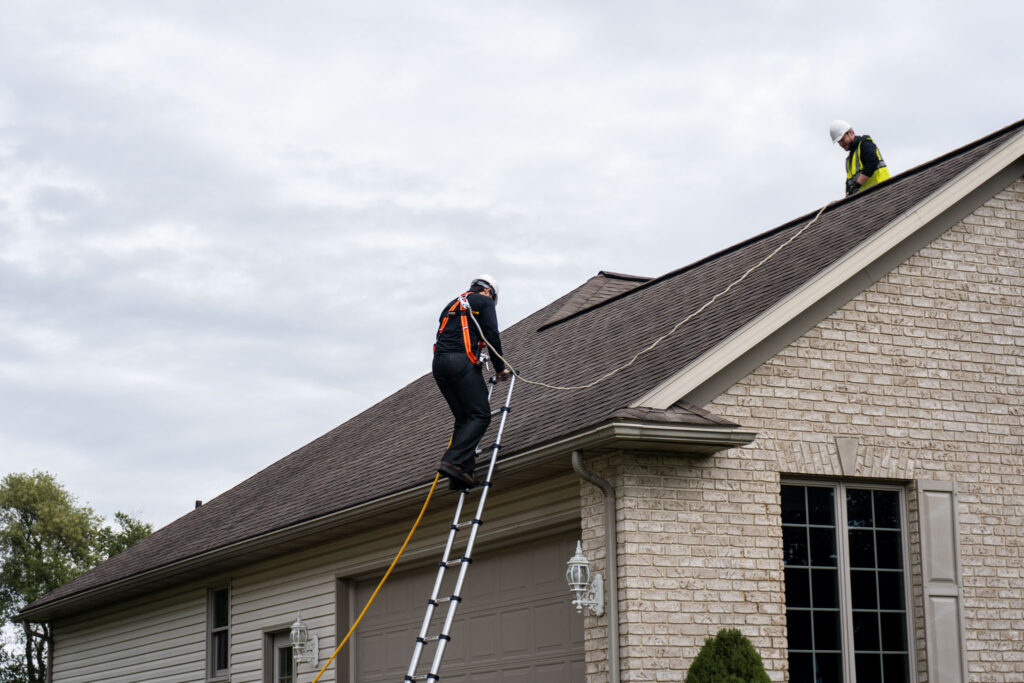 roofer climbing a ladder in Dublin Ohio